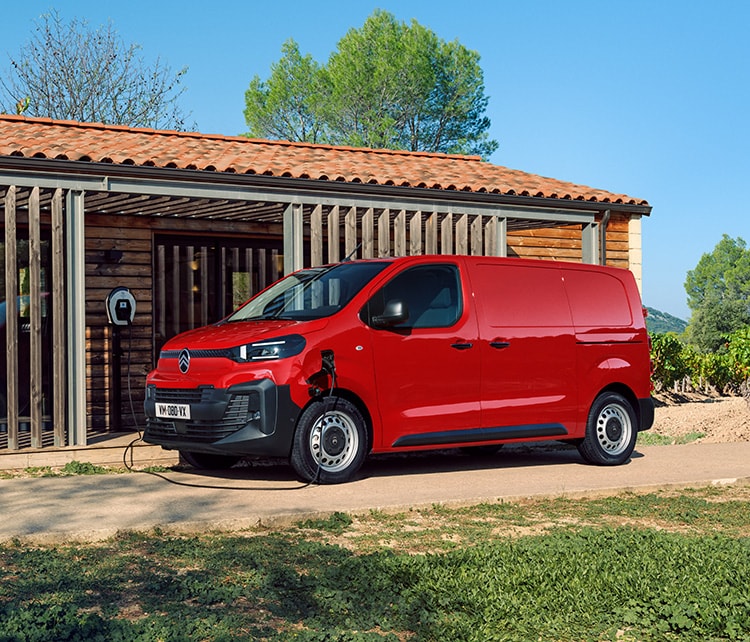 New red electric ë-jumpy recharging at an electric charging point